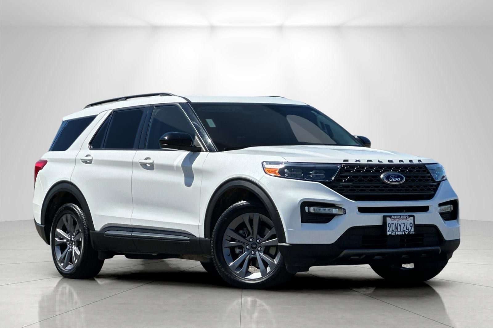 2022 Ford Explorer XLT in Star White Metallic Tri-Coat — front three-quarter view