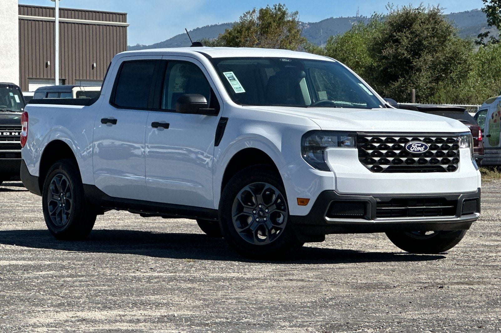 2026 Ford Maverick XLT in Oxford White — front three-quarter view
