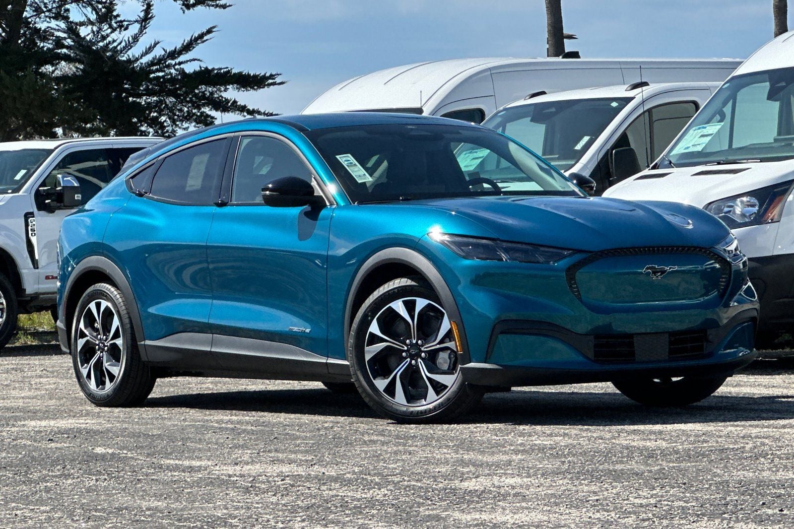 2026 Ford Mustang Mach-E Select in Adriatic Blue Metallic — front three-quarter view